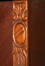 ornamental engraving on an old wooden cabinet