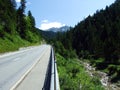 Regional road between the alpine settlements Steg and Malbun, and along the valley of the Malunbach stream in the Lichtenstein Royalty Free Stock Photo