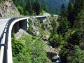 Regional road between the alpine settlements Steg and Malbun, and along the valley of the Malunbach stream in the Lichtenstein Royalty Free Stock Photo