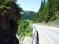 Regional road between the alpine settlements Steg and Malbun, and along the valley of the Malunbach stream in the Lichtenstein Royalty Free Stock Photo