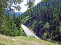 Regional road between the alpine settlements Steg and Malbun, and along the valley of the Malunbach stream in the Lichtenstein Royalty Free Stock Photo