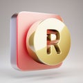 Registered icon. Golden Recycle symbol on red matte gold plate