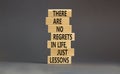 Regrets or lessons symbol. Concept words There are no regrets in life just lessons on wooden blocks on a beautiful grey table grey Royalty Free Stock Photo