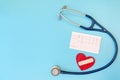 Regular check-ups with a doctor. Health medical care concept. Stethoscope, heart cardiogram and red heart on blue Royalty Free Stock Photo