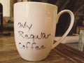 Only regular coffee writing on cup