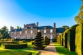 Regular garden in little french castle, sunset time