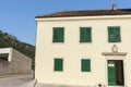 Regular pattern of green windows and door in exterior wall of museum building Croatia Royalty Free Stock Photo