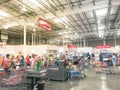 Regular and self-checkout kiosks area with busy customers of Costco in Dallas