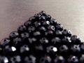 Black triangular beads Royalty Free Stock Photo