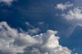 Regular spring clouds on blue sky at daylight. Close shot wit telephoto lens and polarizing filter.