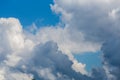 Regular spring clouds on blue sky at daylight in continental europe. Close shot with telephoto lens