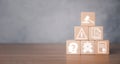 Wooden block on desk with regulation icon on virtual screen, gavel, laptop and legal book on white wooden