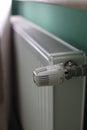 Regulator of heating system radiator in the bedroom Royalty Free Stock Photo