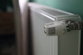 Regulator of heating system radiator in the bedroom Royalty Free Stock Photo