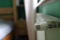 Regulator of heating system radiator in the bedroom Royalty Free Stock Photo