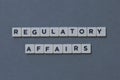 ' Regulatory Affairs ' word made of square letter word on grey background