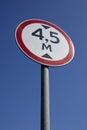 Regulatory-sign on a road under blue sky