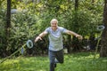 Rehabilitated senior man throwing his crutches