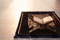 Rehal with open Quran and Muslim prayer beads Royalty Free Stock Photo