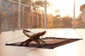 Rehal with open Quran and Muslim prayer beads on rug indoors. Royalty Free Stock Photo