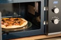 reheating pizza in the microwave Royalty Free Stock Photo