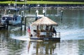 Rehoboth Beach, Delaware, U.S.A - August 13, 2022 - The small Tiki bar floating by the bay in the summer