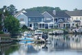 The view of the luxury waterfront homes with boat lifts by the bay near Rehoboth Beach, Delaware, U.S