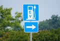 Rehoboth Beach, Delaware, U.S.A - June 18, 2023 - The EV sign for the charging station for electric vehicles Royalty Free Stock Photo