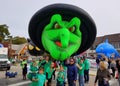 Rehoboth Beach, Delaware, U.S.A - October 26, 2019 - A green witch float on Seawitch Festival parade and the marchers on the