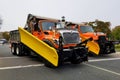 Rehoboth Beach, Delaware, U.S.A - October 26, 2019 - Huge orange and yellow trucks with snow plow