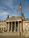 Reichstag building in Berlin, Germany and German flag in front Royalty Free Stock Photo