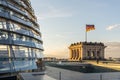 Reichstag glass dome of the Parliament in Berlin (Bundestag) with German flag Royalty Free Stock Photo