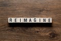 Reimagine - word concept on building blocks, text Royalty Free Stock Photo