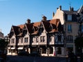 Reims summer street with traditional half-timbered building