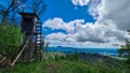 Rein - Wooden observation tower with along idyllic hiking trail in lush green forest in Grazer Bergland Royalty Free Stock Photo