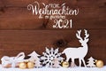 Reindeer, Gift, Tree, Golden Ball, Snow, Glueckliches 2021 Means Happy 2021 Royalty Free Stock Photo