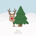 Reindeer red nose behind tree snowy background