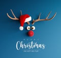 Reindeer with red nose and Santa hat on blue Christmas background Royalty Free Stock Photo