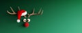 Reindeer with red nose and Santa hat on green Christmas background Royalty Free Stock Photo