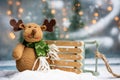 Reindeer with sledges for Christmas presents and festive background Royalty Free Stock Photo