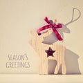 Reindeer and text seasons greetings, filtered