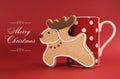 Reindeer vanilla cookie biscuit with red polka dot cup of coffee