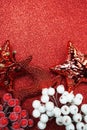 Reindeer and white berry Christmas decoration on red glitter background Royalty Free Stock Photo