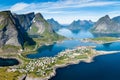 Reine Lofoten Norway, aerial view of Norwegian traditional fishing village above polar circle with blue sea and mountains during Royalty Free Stock Photo
