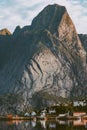 Reine village in Norway Lofoten islands landscape mountain and houses water reflection