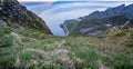 Reinebrinen, Norway - June 1, 2016: The road to climb to reach the famous top peak Reinbringen, Lofoten Islands, with a view on fa