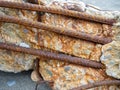 Reinforced concrete. Destroyed building material. Rusty iron. Reinforced concrete wall. Construction garbage. consequences of Royalty Free Stock Photo