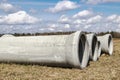 Reinforced concrete storm sewer pipes of large diameter stacked at a construction site. Sewer Large diameter pipes. Wastewater Royalty Free Stock Photo