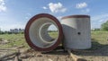 Reinforced concrete storm sewer pipes of large diameter stacked at a construction site. Sewer Large diameter pipes Royalty Free Stock Photo