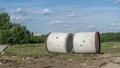 Reinforced concrete storm sewer pipes of large diameter stacked at a construction site. Sewer Large diameter pipes Royalty Free Stock Photo